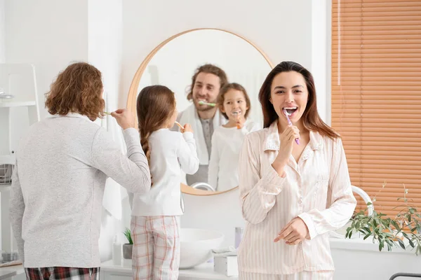 Young Woman Her Husband Little Daughter Brushing Teeth Bathroom — Stock Photo, Image