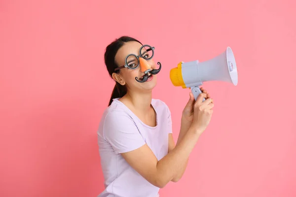 Young Woman Funny Disguise Shouting Megaphone Pink Background April Fools — Stock Photo, Image