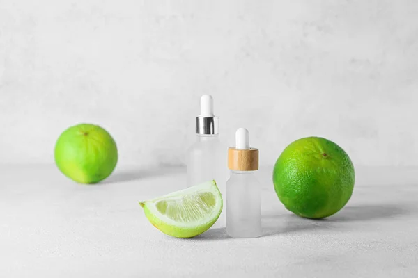 Bottles Bergamot Essential Oil Ripe Fruits Light Background — Stock Photo, Image