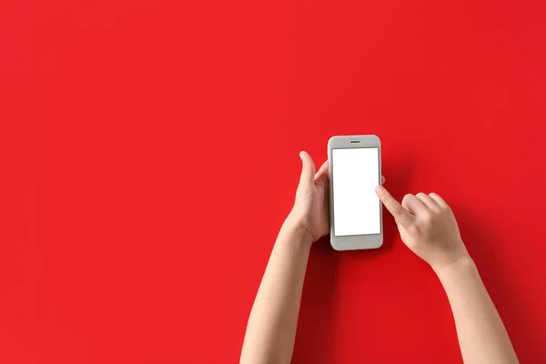 Child Using Modern Mobile Phone Red Background — Stock Photo, Image