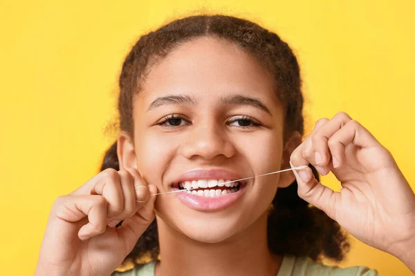African American Teenage Girl Flossing Teeth Yellow Background Closeup — Stock Photo, Image