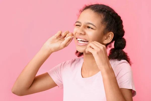 African American Teenage Girl Flossing Teeth Pink Background — Stock Photo, Image