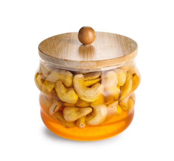 Pot Smakelijke Cashewnoten Met Honing Witte Achtergrond — Stockfoto