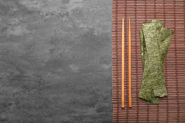 Bamboo Mat Tasty Seaweed Sheets Chopsticks Black Background — Stock Photo, Image