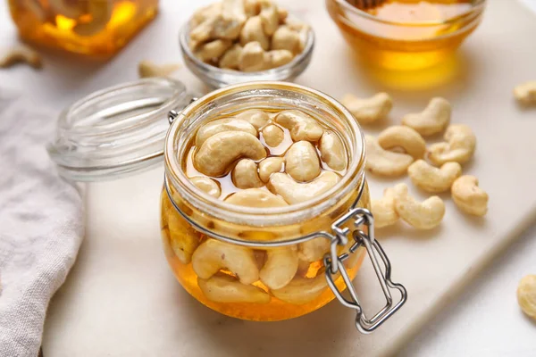 Jar Tasty Cashew Nuts Honey Light Background Stock Image
