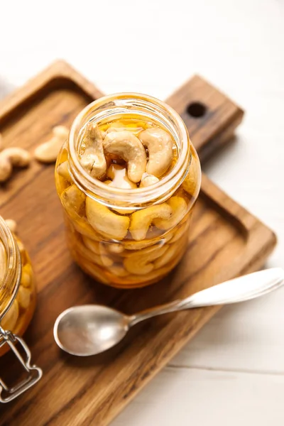 Jar Tasty Cashew Nuts Honey White Wooden Background Stock Photo