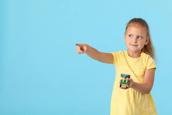 Cute Little Girl Building Blocks Pointing Something Blue Background — Stock Photo, Image