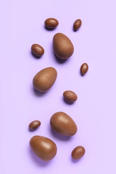 Delicious Chocolate Eggs Purple Background — Stock Photo, Image
