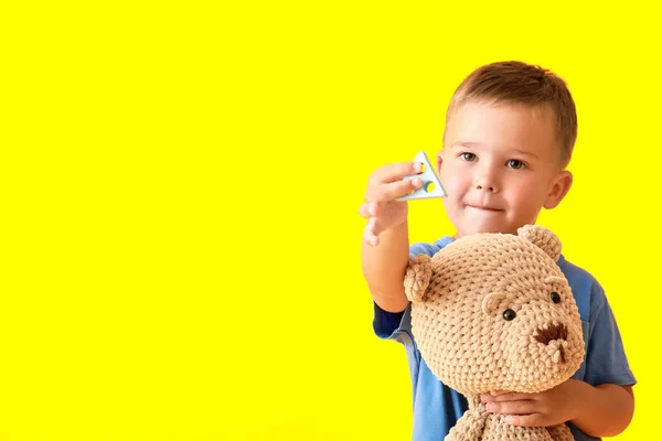 Cute Little Boy Building Block Teddy Bear Yellow Background — Stock Photo, Image
