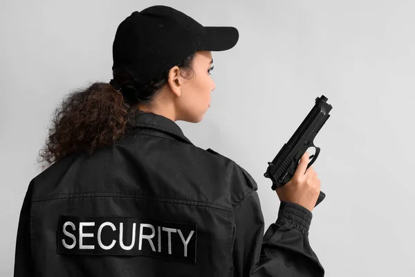 African American Female Security Guard Gun Light Background — Stock Fotó
