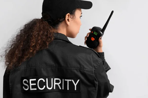 African American Female Security Guard Radio Transmitter Light Background — Stock Photo, Image