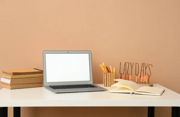 Modern Laptop Stack Books Stationery Supplies Table Color Wall — Stock Photo, Image