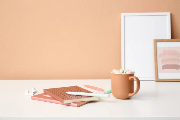 Stationery Supplies Earphones Cup Cacao Table Color Wall — Stock Photo, Image