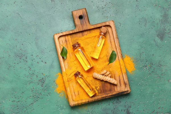 Bottles Oil Turmeric Root Powder Green Background — Stock Photo, Image