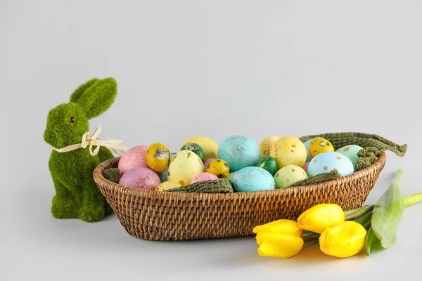 Wicker Basket Painted Easter Eggs Flowers Figurine Bunny Light Background — Stock Photo, Image
