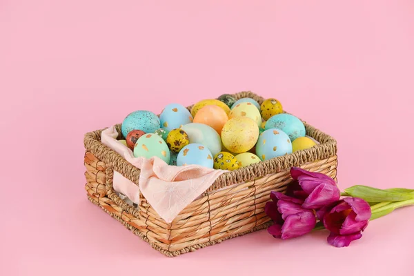 Wicker Basket Painted Easter Eggs Flowers Pink Background — Stock Photo, Image