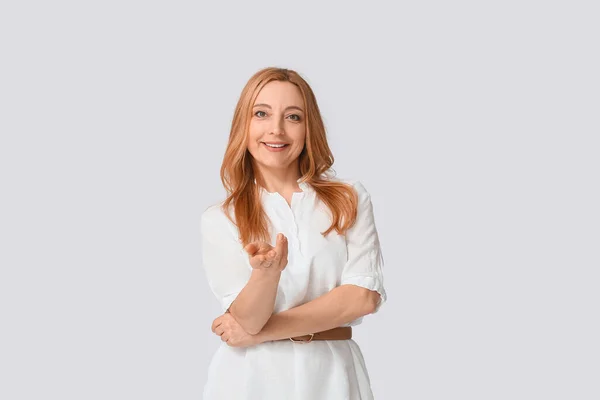 Mature Woman Showing Come Here Gesture Grey Background — Stock Photo, Image