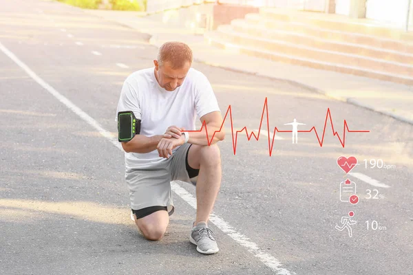 Mature Male Runner Checking Pulse Outdoors — Stock Photo, Image