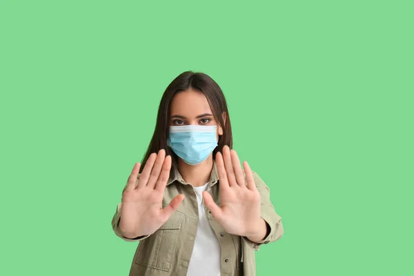 Young Woman Medical Mask Showing Stop Gesture Green Background Immunity — Stock Photo, Image