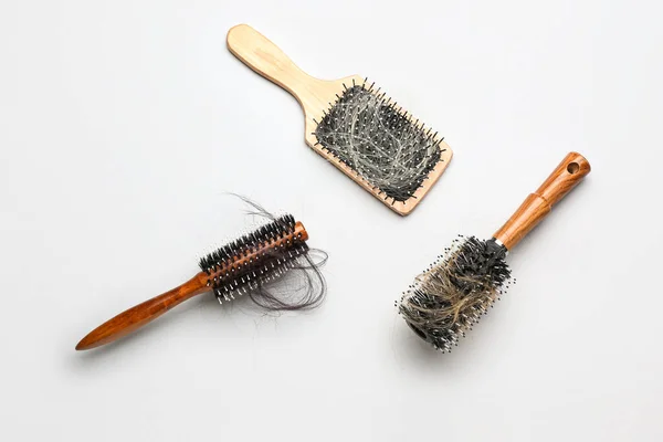 Brushes Fallen Hair White Background — Stock Photo, Image