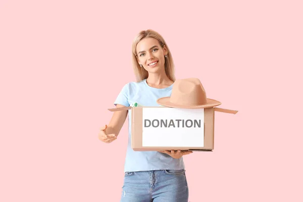 Young Woman Holding Box Donation Clothes Pink Background — Stock Photo, Image