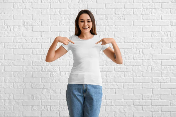 Young Woman Blank Shirt White Brick Background — Stock Photo, Image