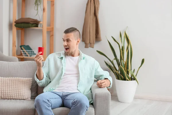 Emotional Man Holding Wireless Portable Speaker Sofa Room — Stock Photo, Image