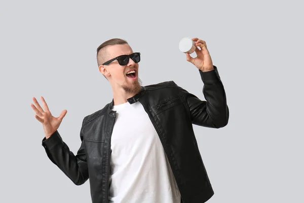 Emotional Man Sunglasses Holding Wireless Portable Speaker Grey Background — Stock Photo, Image