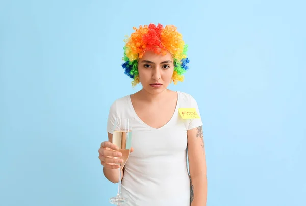 Funny Young Woman Colorful Wig Champagne Blue Background April Fools — Stock Photo, Image