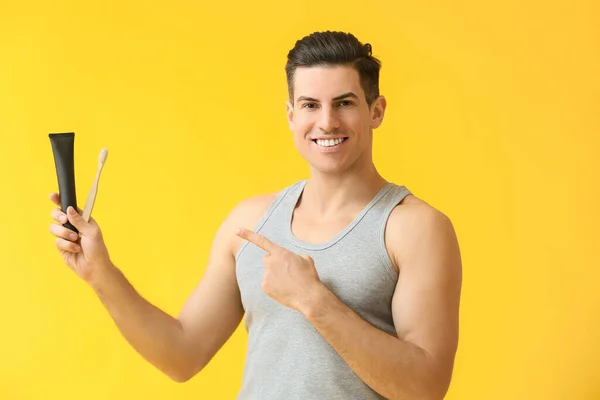 Handsome Young Man Activated Charcoal Tooth Paste Brush Yellow Background — Stock Photo, Image