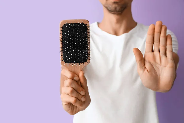 Young Man Holding Brush Fallen Hair Showing Stop Gesture Lilac — Stock Photo, Image