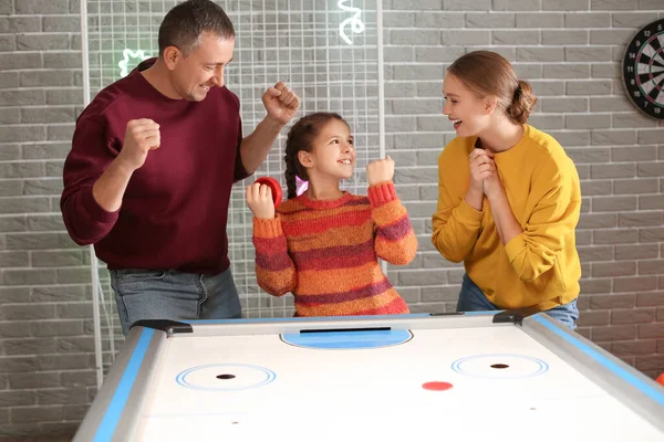 Family Playing Air Hockey Indoors — Stock Photo, Image