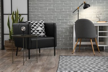 Siyah koltuk, lambalı masa ve oturma odasında modern iş yeri.