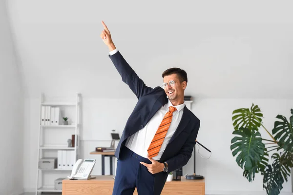 stock image Dancing young businessman in office