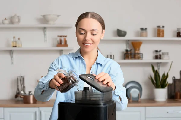 Young Woman Putting Beans Coffee Machine Kitchen — Stock Photo, Image