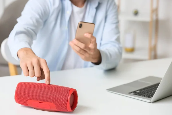 Man Connecting Mobile Phone Wireless Portable Speaker Table Closeup — Stock Photo, Image