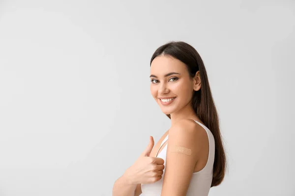 Young Woman Applied Medical Patch Showing Thumb Light Background — Stock Photo, Image