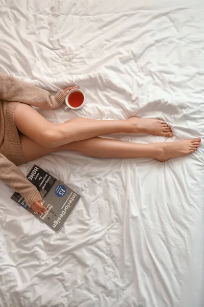 Barefoot Woman Cup Tea Magazine Sitting Bed Home — Stock Photo, Image