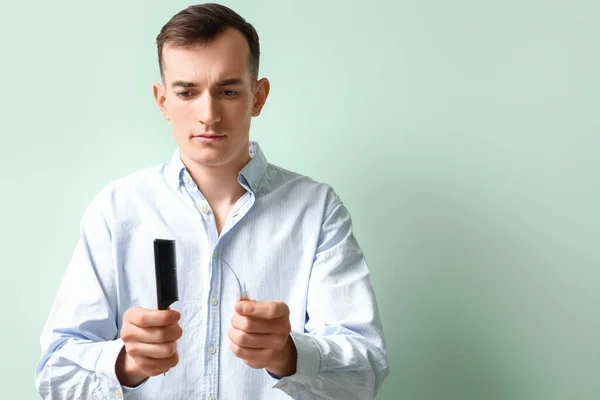 Young Brunette Man Fallen Hair Comb Green Background — Stock Photo, Image