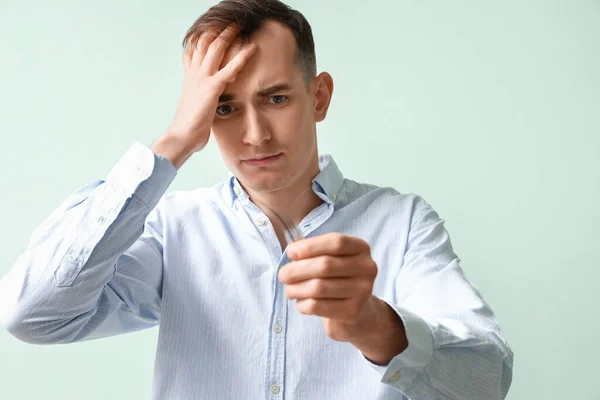 Upset Young Man Fallen Hair Green Background — Stock Photo, Image