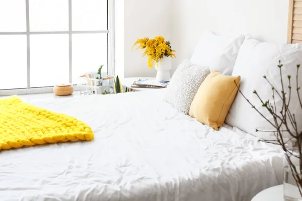 Table Mimosa Flowers Vase Magazines Comfortable Bed Light Wall — Stock Photo, Image