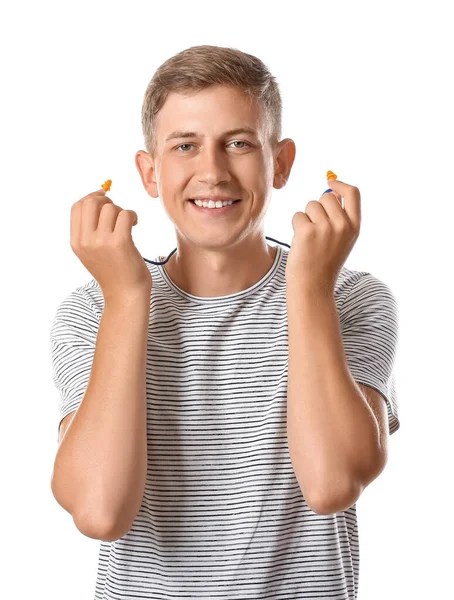 Joven Guapo Con Tapones Para Los Oídos Sobre Fondo Blanco —  Fotos de Stock