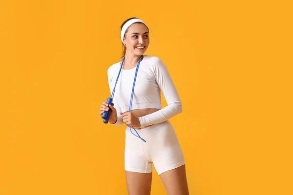 Sporty Young Woman Skipping Rope Color Background — 图库照片