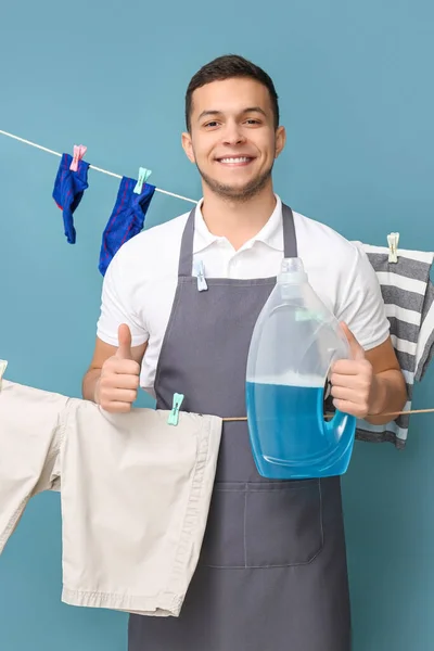 Young Man Hanging Clean Laundry Clothespins Detergent Showing Thumb Blue — ストック写真