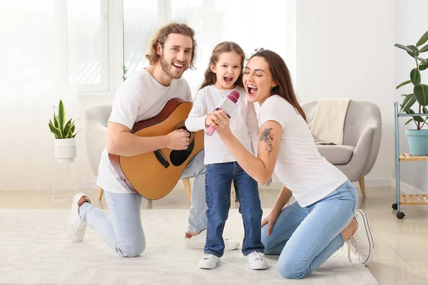 Happy family singing song at home