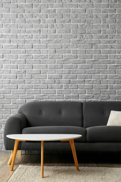 Stylish Sofa Table Grey Brick Wall — Stock Photo, Image