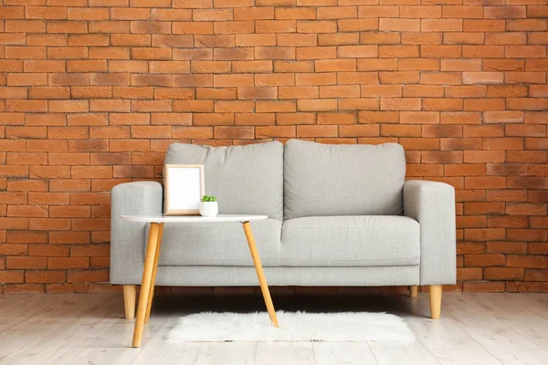 Stylish Sofa Table Brick Wall — Stock Photo, Image