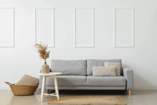 Stylish Sofa Basket Pillow Table White Wall — Stock Photo, Image