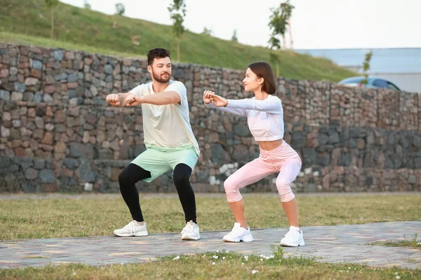 Sporty Young Couple Exercising Outdoors — Stock Photo, Image