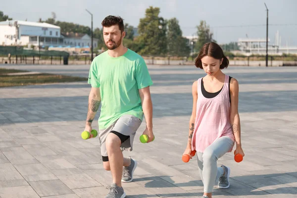 Sporty Young Couple Training Dumbbells Outdoors — Stock Photo, Image